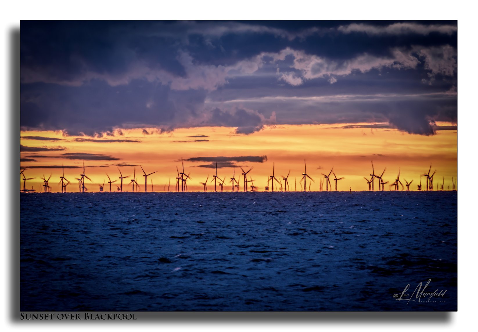 Windfarms at Sunset northern end of Blackpool seafront.